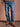 Jean de Demons & Machines de calce oversize. De tiro medio, este fit cae relajado con una apertura de pierna amplia y recta que continua regular hacia la botamanga. Lavado stone con sobre teñido crudo logrando un tono celeste vintage, gastados localizados y roturas reparadas a mano para un auténtica apariencia vintage.