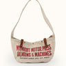 Inspirado en las primeras bolsas usadas para el reparto de periódicos, nuestro Bolso Newspaper puede usarse sobre el hombro o cruzado. Confeccionado artesanalmente en lona pesada de algodón, con broches snap metálicos, presillas en cuero vacuno con tratamiento envejecido y correa ancha de algodón reforzada con múltiples pespuntes. Cuenta con bolsillo interno. Arte de marca de estética vintage estampado en serigrafía.