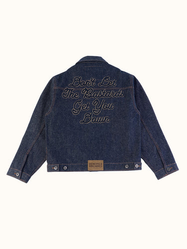 Campera Tokyo Bastards azul, espalda en plano con bordado Don't Let The Bastards Get You Down #color_azul