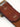 Cinturón modelo clásico confeccionado artesanalmente en cuero vacuno con terminación envejecida. Hebilla rectangular metálica grande en baño oro italiano y remaches baño cobre con refuerzo de cuero. Logo de marca grabado en bajo relieve. Forma parte de nuestra línea artesanal de accesorios de edición limitada, donde ningún producto es exactamente igual al otro. #color_marr-n