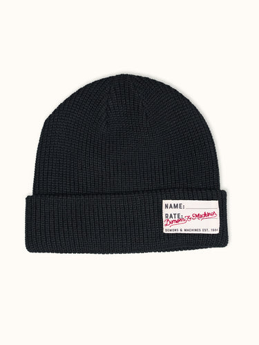 Gorro tejido negro de la marca Demons & Machines, estilo beanie, con diseño cálido y ajustado para invierno.  #color_negro