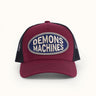 Gorra trucker Demons & Machines, con bordado en la frente y malla de nylon en la parte trasera. Talle único, cierre ajustable. #color_bordo