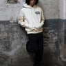 Chain Hoodie in Ivory, construction detail — the reverse terry triangle insert at the neckline. #color_ivory