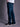 Jean de Demons & Machines de calce boot-cut confeccionado en denim elastizado. De tiro medio-alto, con entalle regular en cintura y cadera, y pierna que se va despegando terminando en una botamanga ligeramente abierta, ideal no solo para las botas sino para acompañar todo tipo de calzado.