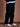 Pantalón cargo Benson negro de la marca Demons & Machines, vista frontal con bolsillos laterales y diseño robusto. #color_negro